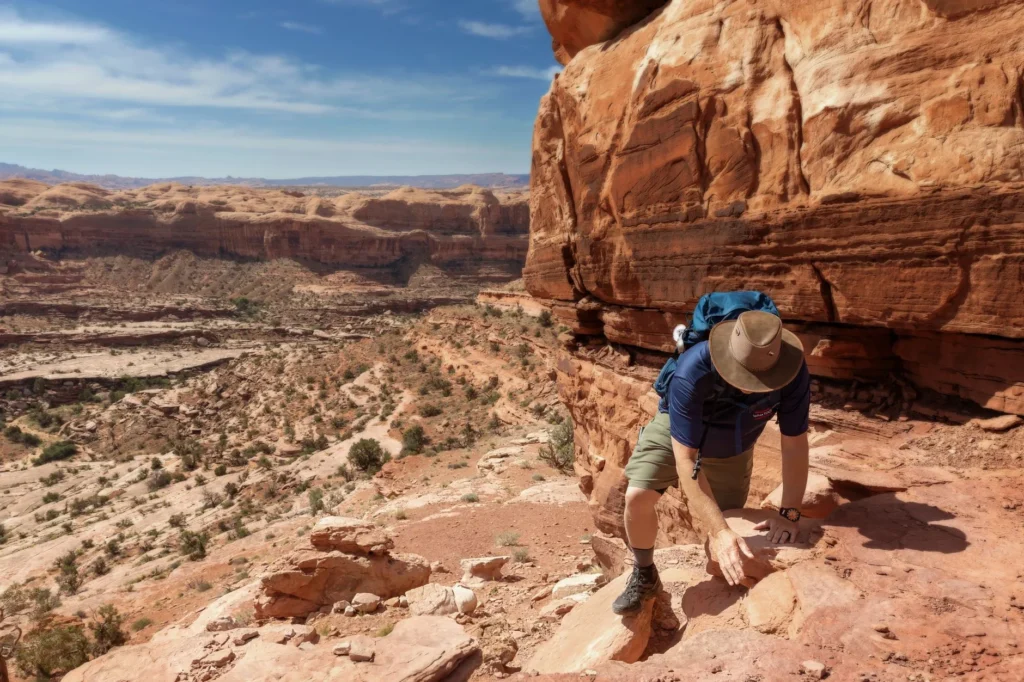 man hiking in the rocky desert